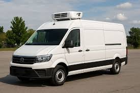 A refrigerated chiller van for catering services in Dubai loaded with food trays